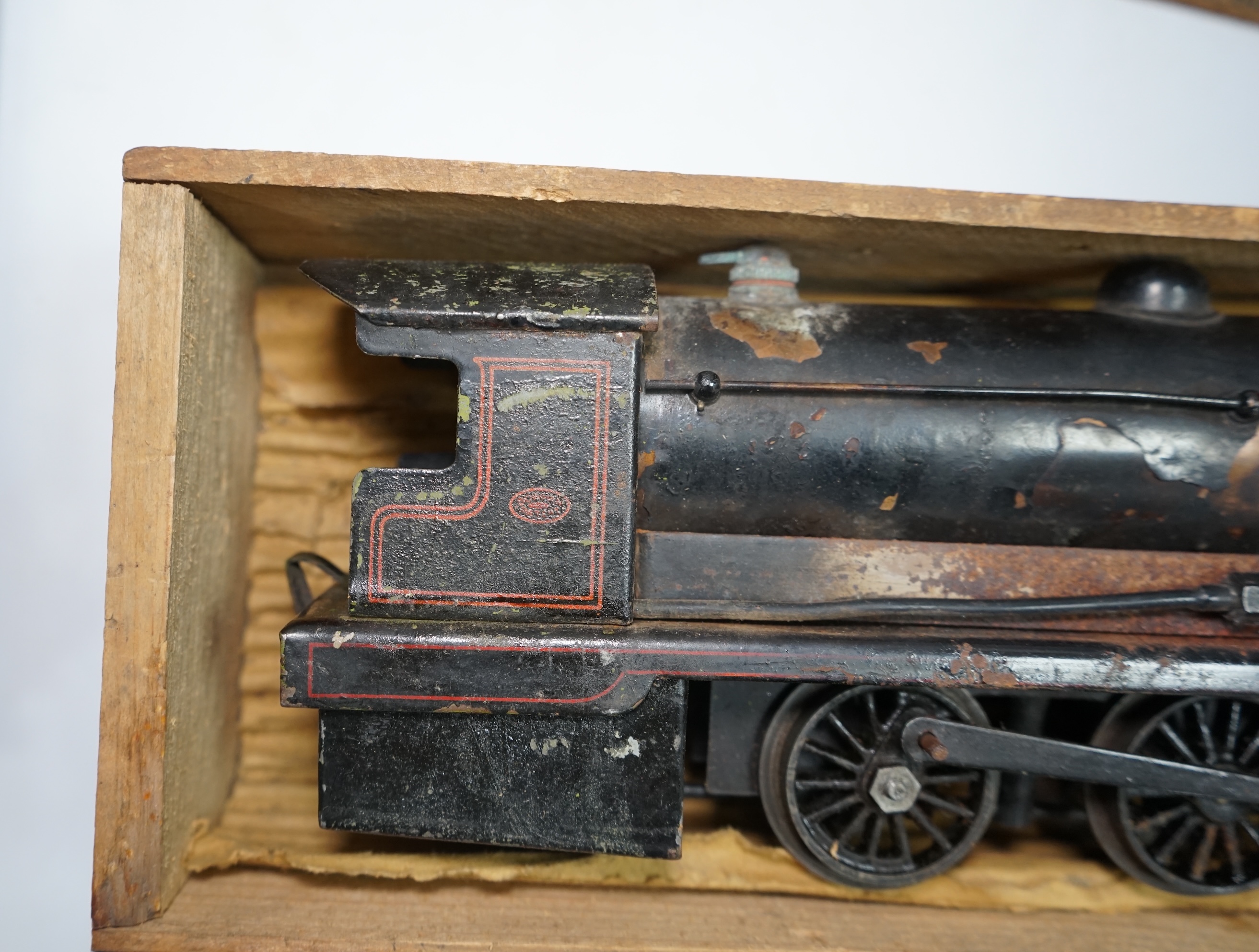 A wooden boxed Bowman Models live steam spirit fired 0 gauge 4-4-0 tender locomotive (without tender), loosely styled in black LNWR livery, together with a tinplate 0 gauge Bing for Bassett Lowke LNER teak bogie coach, 1